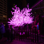 Purple Glowing Twinkle Tree at night