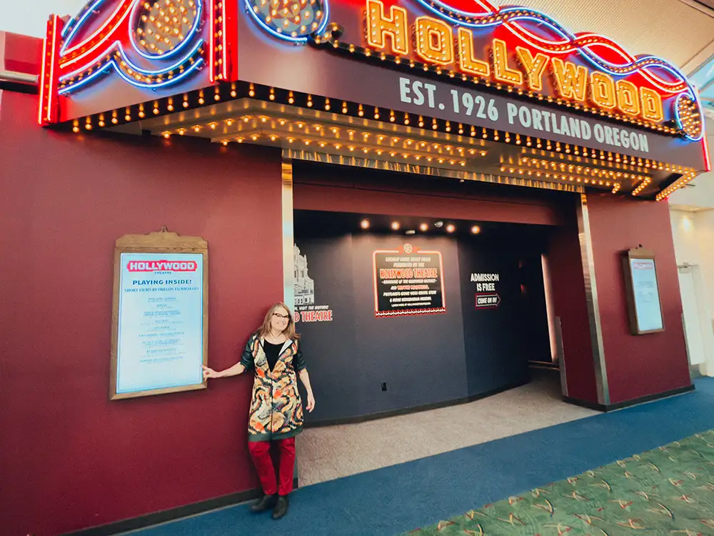 Woman standing in front of Hollywood Theatre annex entrance