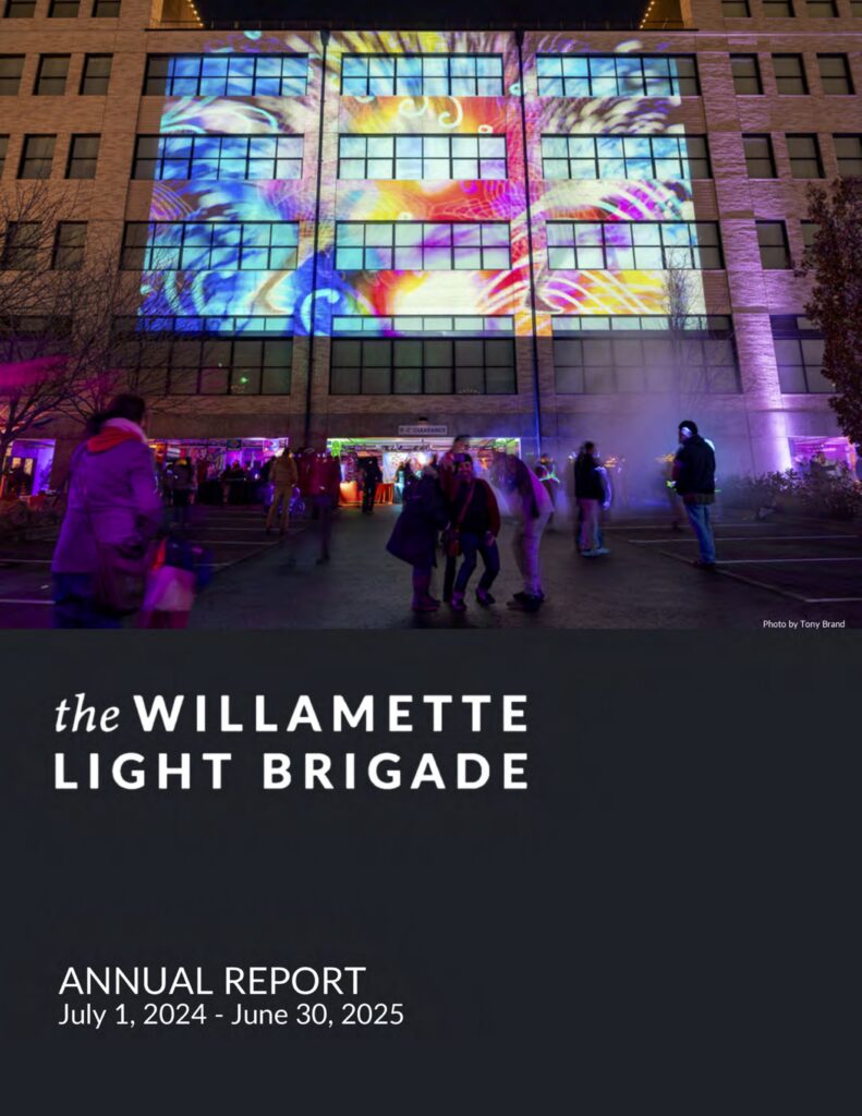 front page of annual report for The WIllamette Light Brigade image of people dancing under projected light