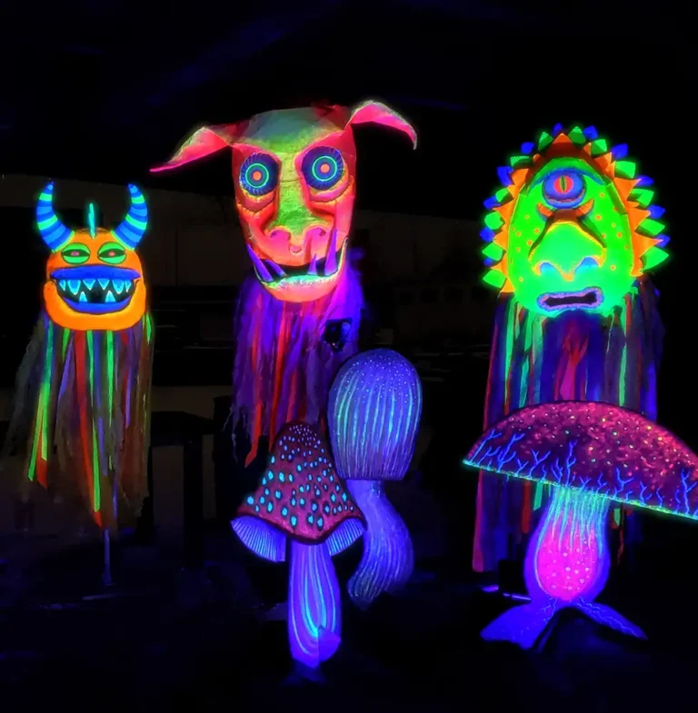 glowing cardboard monster puppet heads and mushrooms