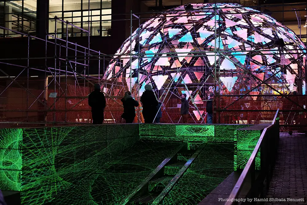 illuminated geodesic dome at night